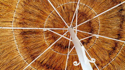 Sun umbrellas on the beach by the sea