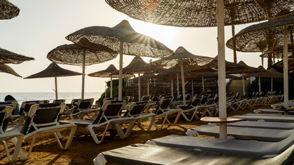 Sun umbrellas on the beach by the sea