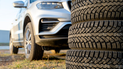 Winter tires near the garage. Safety concept for winter driving. Purchase and purchase of new tires for the car