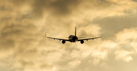 Passenger liner in the sky at dawn or sunset