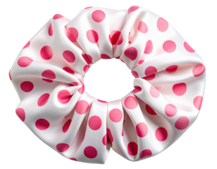 Polka dot silk scrunchie in pink and white, isolated on a transparent background