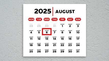 The date August 6th marked with a red cursor on the wall calendar 2025