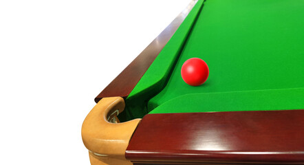 Green felt snooker table corner with red snooker balls on the table.