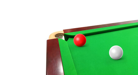Red and white snooker balls on the snooker table, left corner of the hole.