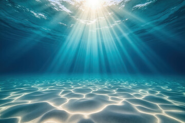 Sunlight Beams Penetrating Clear Ocean Water Illuminating Sandy Bottom Creating a Tranquil Underwater View