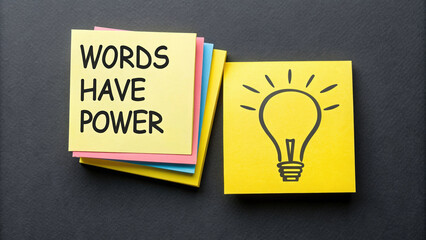 Words Have Power Concept with Light Bulb Illustration on Sticky Notes on Dark Background for Ideas