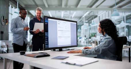 Multiracial Team Using Online Accounting Software