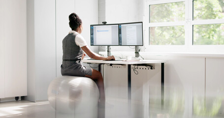 African American Woman Working On Exercise Ball