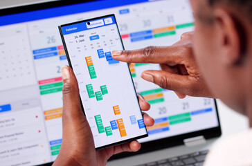 Busy Business Woman Schedules Appointments On Her Laptop