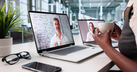 Woman In Office Sips Coffee While
