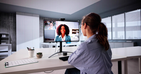 Young Caucasian Woman Using Technology To Attend Virtual Business Seminar