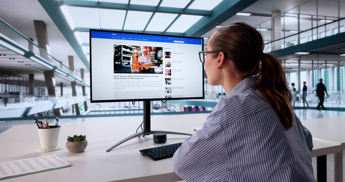 Female Journalist Relaxing On Reads Online News Website