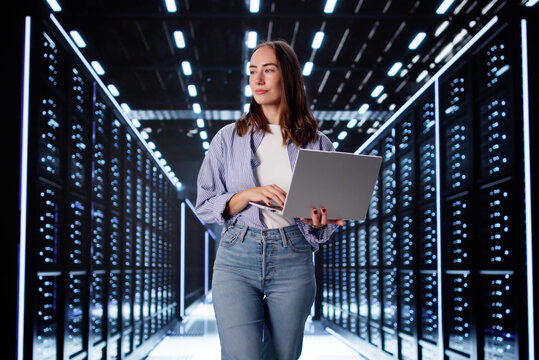 Focused Female Computer Scientist Configuring Systems