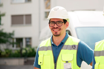 Confident Hispanic Service Technician Walking In Front
