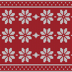 Knitted Christmas pattern in red with white snowflakes and hearts.