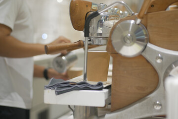 Barista preparing coffee in a modern cafe setting