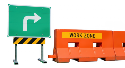 A green road sign with a right turn arrow stands beside an orange "Work Zone" barrier.