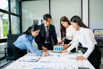 Group of Asian business meeting in planning design in creative business discussing work in office