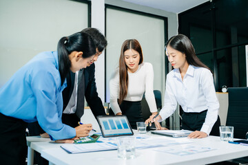 Group of Asian business meeting in planning design in creative business discussing work in office