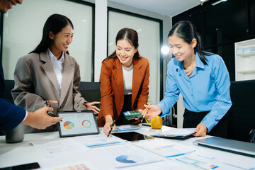 Professional teamwork as business colleagues engage in strategy, planning, and discussion,...
