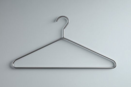 Metal clothes hanger on gray background.
