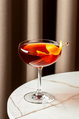 crafted revolver cocktail featuring bourbon, coffee liqueur, orange bitters, and a zest of orange peel for a relaxing night.