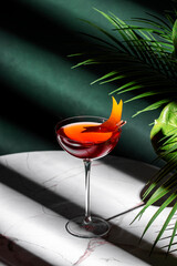 Red italian spritz alcoholic cocktail drink with gentian bitters, juice, sparkling wine and orange...