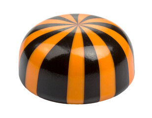 Round caramel candy for Halloween, lollipop. Black and orange striped candy isolated on white background.	
