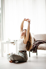 the girl at home admires the view from the window and enjoys a passive weekend