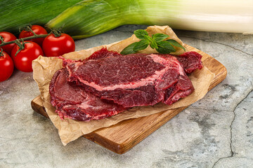 Raw beef cheeks cut for cooking
