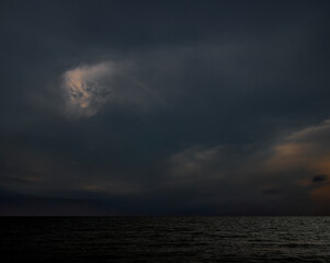 Cloud storm sky dark rain lightning thunder on sea ocean stormy typhoon nature light scene rainy...