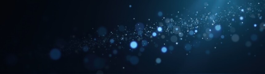 A close up of a blue light shining down on a black background