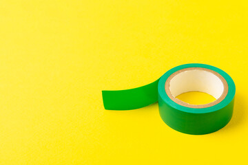 Insulating tape on a bright colored background. Set of different colors insulating tape. Reel...