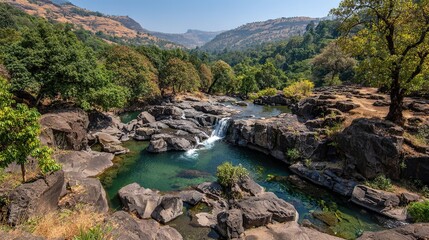River Winding Through a Lush Forest Beneath a Spotless Blue Sky, a Slice of Pristine Natural Beauty