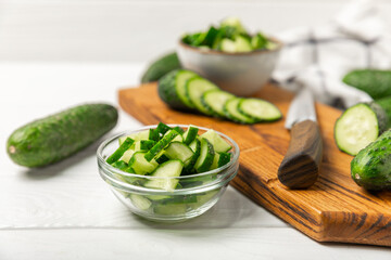 Cucumber on wooden background. Slice of cucumber on background. Fresh organic green cucumbers...