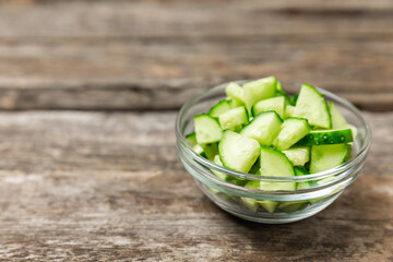 Cucumber on wooden background. Slice of cucumber on background. Fresh organic green cucumbers...