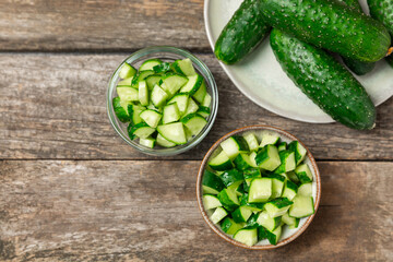 Cucumber on wooden background. Slice of cucumber on background. Fresh organic green cucumbers...