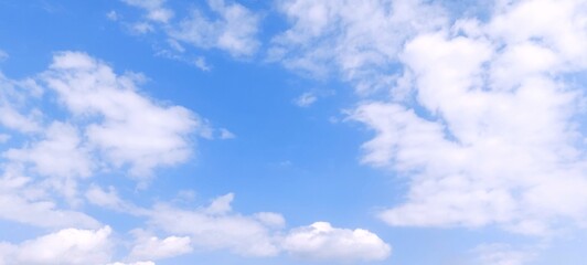 White cumulus clouds in blue sky with daylight natural background. Blue sky with clouds. Soft white clouds float in the clear blue sky. Clear blue sky, bright spring, wallpaper landscape.