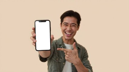 Smiling businessman in a suit holding a smartphone