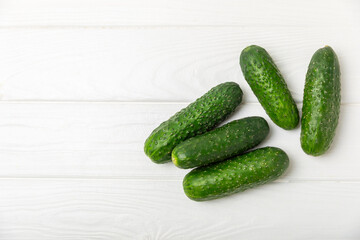 Cucumber on wooden background. Slice of cucumber on background. Fresh organic green cucumbers...