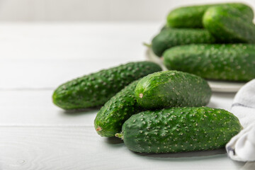 Cucumber on wooden background. Slice of cucumber on background. Fresh organic green cucumbers...