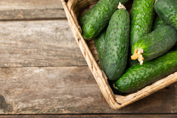 Cucumber on wooden background. Slice of cucumber on background. Fresh organic green cucumbers...