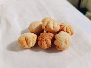 Seashell Madeleine Cookies or Kue Bhoi on White Surface