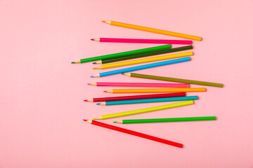 Colored pencils on a bright colored background. Equipment for coloring. Stationery for creativity.Back to school. Flatlay. Children's Creativity and Education. Rainbow.Space for text. Copy space.