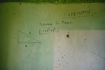 mathematical formula Pythagoras' theorem written on the wall, scratches on the plaster