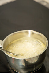 Boiling sugar syrup in a saucepan