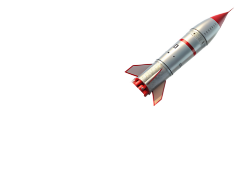 A silver and red rocket with fins pointing upwards against a stark black background in the right corner