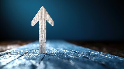 Wooden Arrow Symbol on Textured Surface: Directional Growth and Navigation