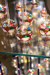 Hand-Painted Glass Ornaments Reflecting Light