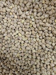 Chickpeas displayed in bulk at a local market showcasing various shades and textures in early morning light